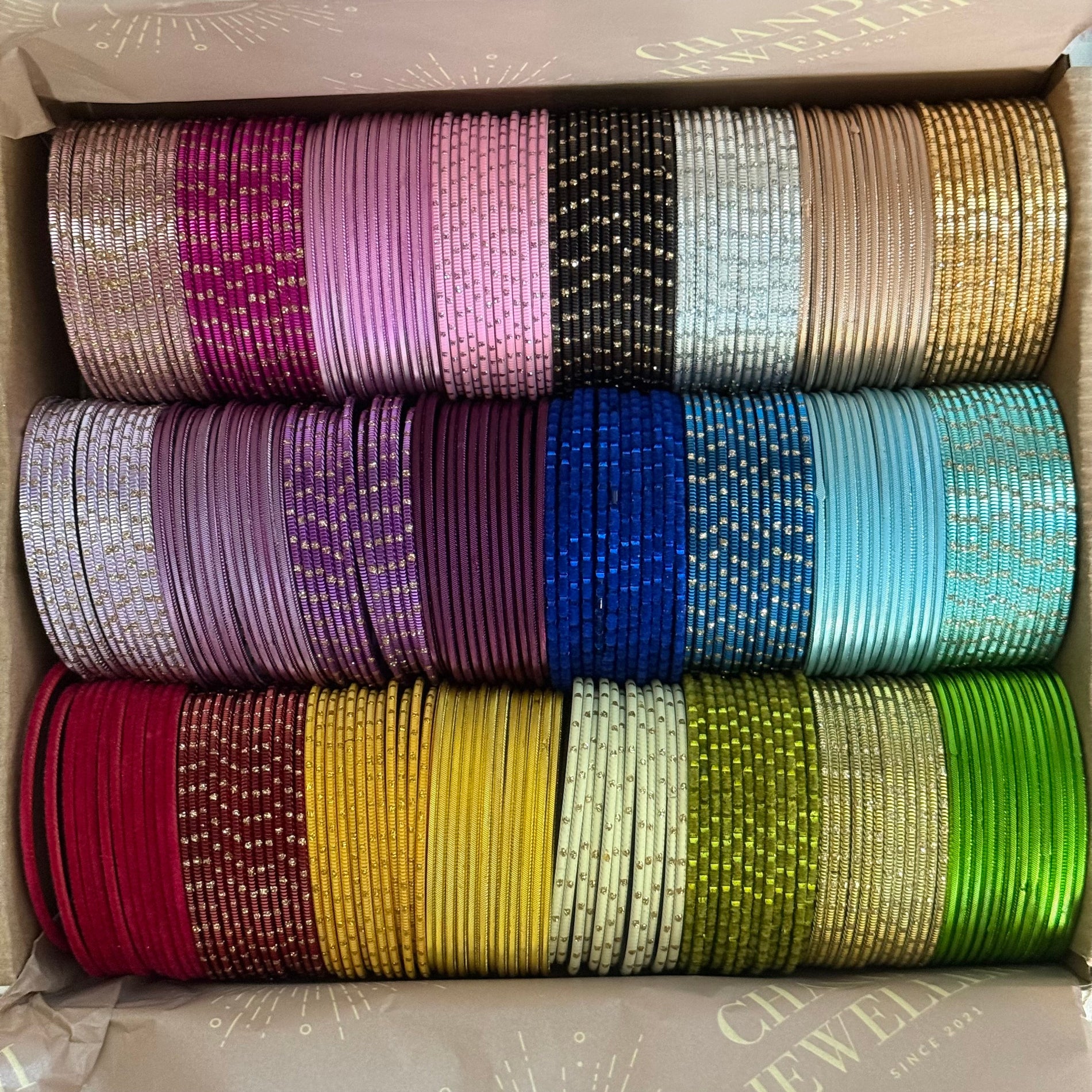 Box of colorful bangles stacked in rows