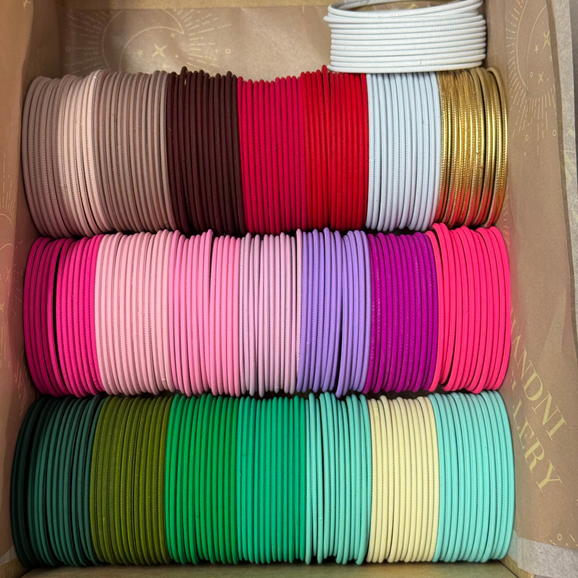 colourful bangles on a brown boz
