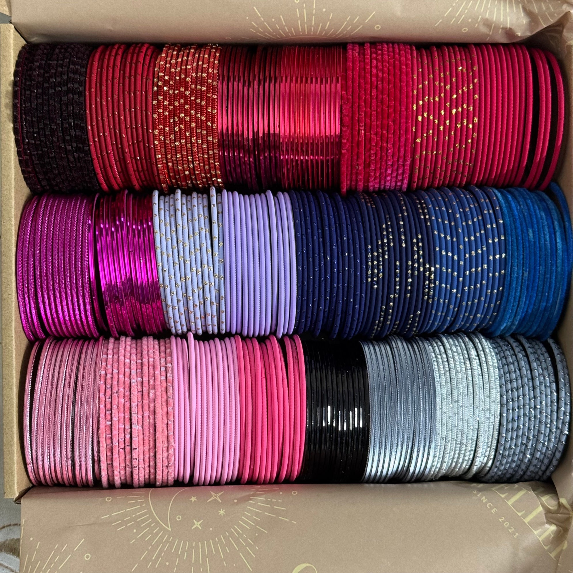 Stack of colorful bangles in a box