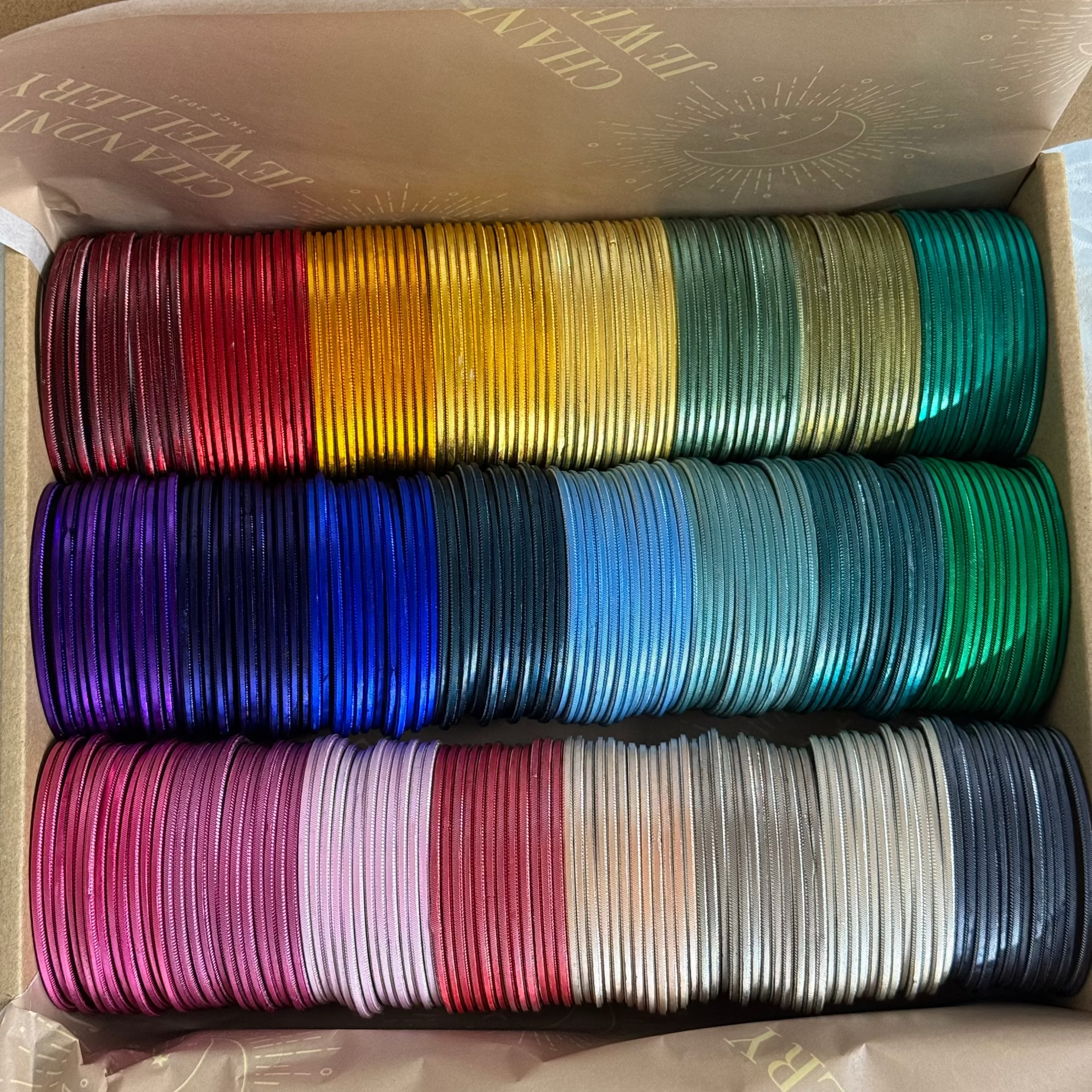Box of colourful bangles 