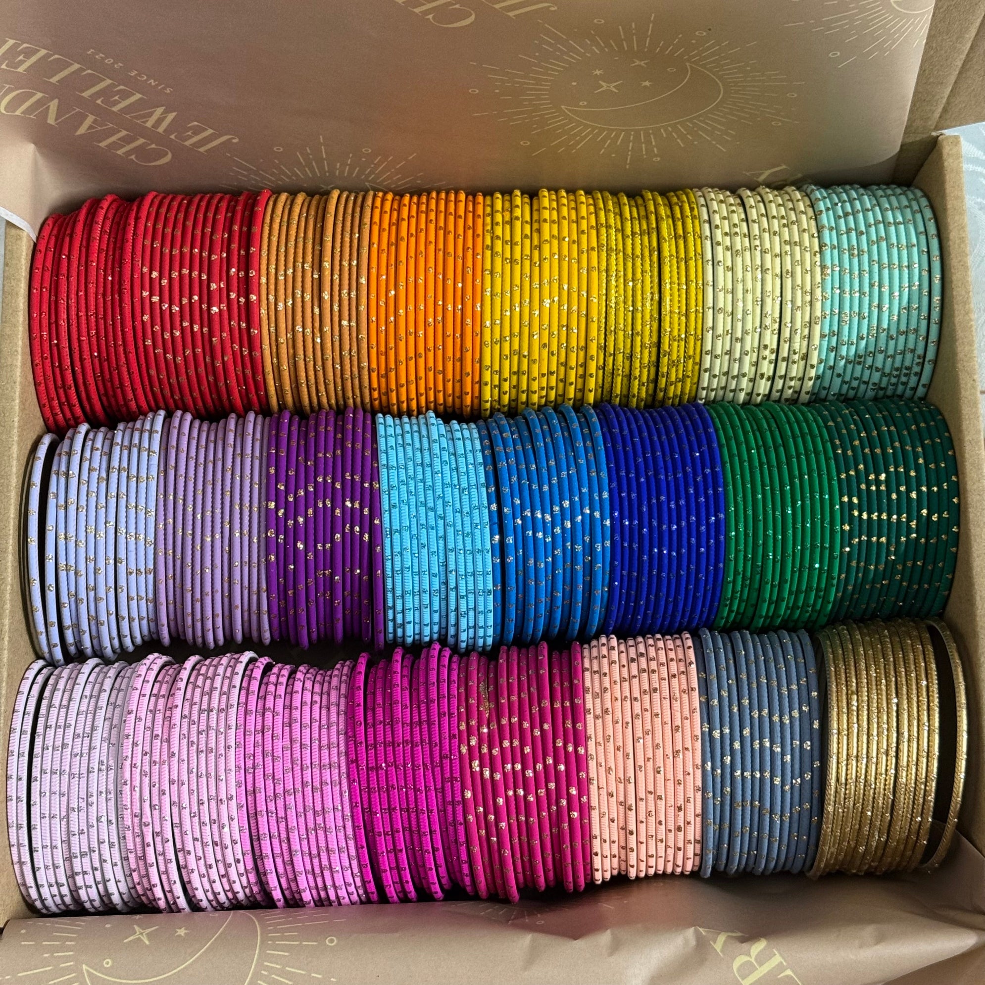 Bocx of colourful dotted bangles