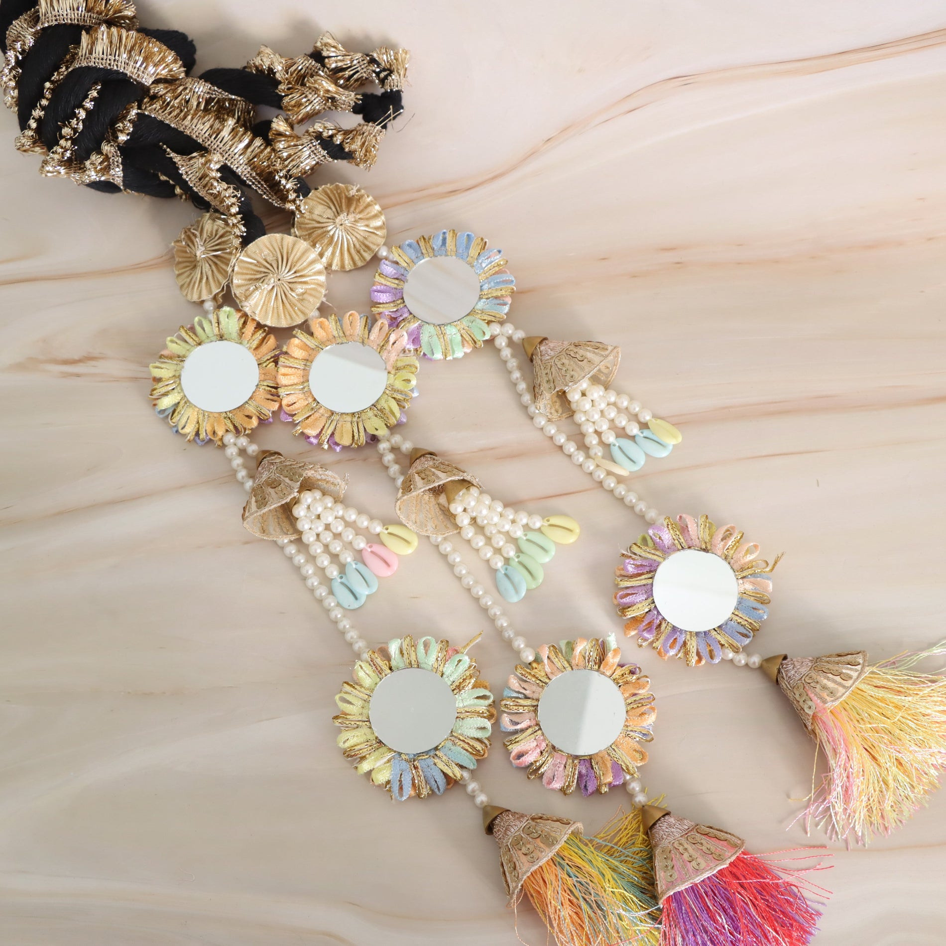 Decorative Parandi with mirror work and pastel coloured tassels