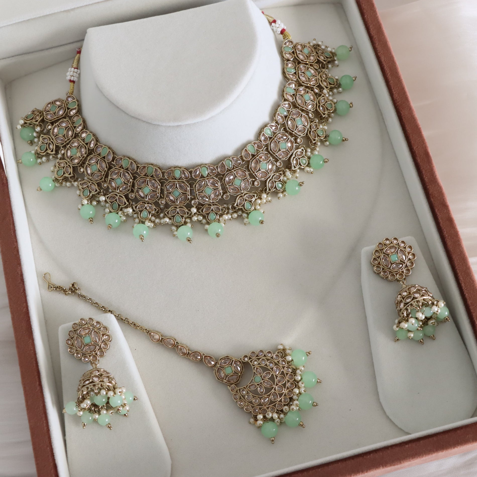 Jewelry set with necklace, pendant, and earrings in a box