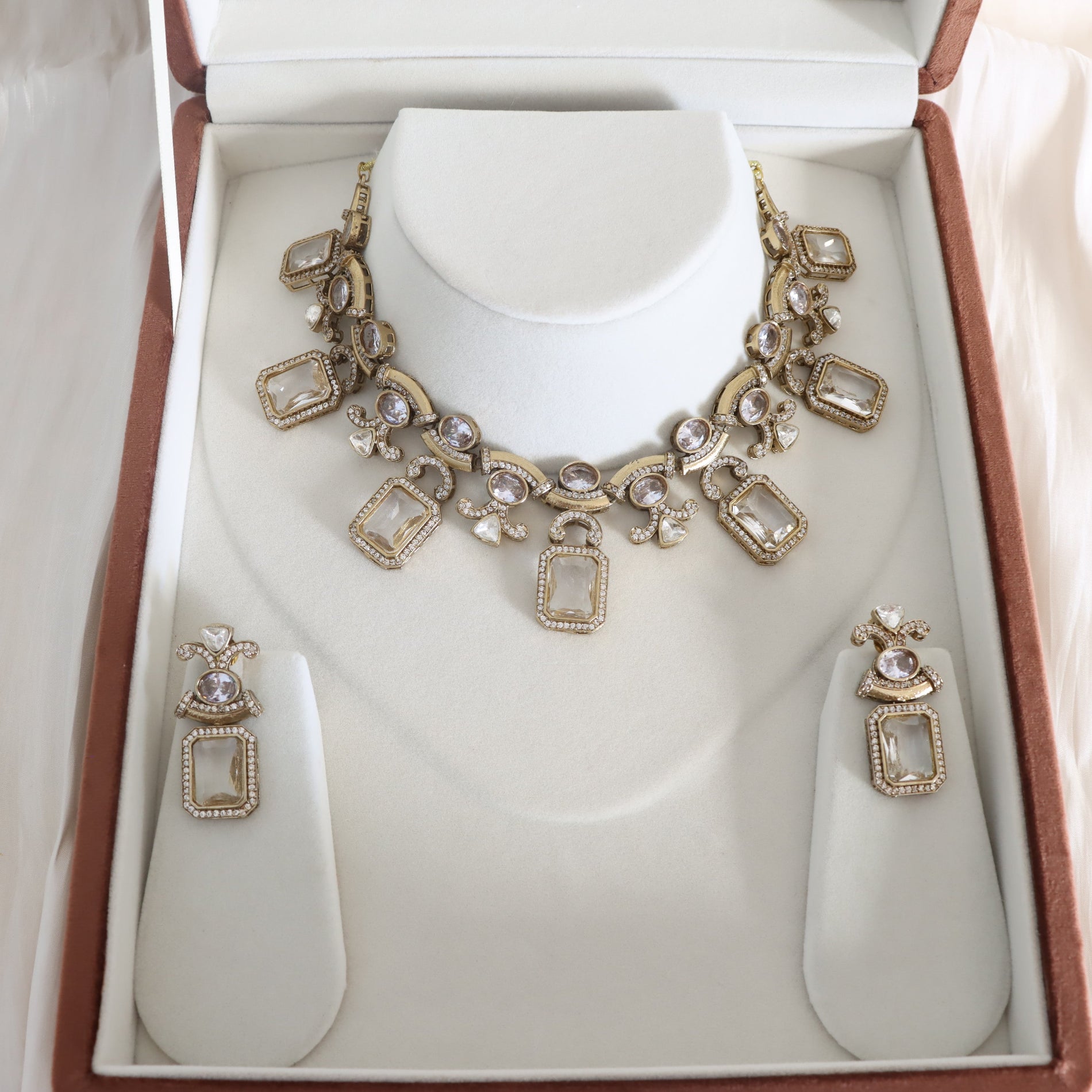 Necklace and earrings set in a jewelry box